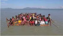  ?? - Reuters file ?? FLEEING TO SAFETY: Rohingya refugees cross the Naf River with an improvised raft to reach to Bangladesh at Sabrang near Teknaf, Bangladesh November 10, 2017.