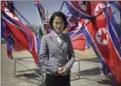  ??  ?? Jang Sol Hyang, 19, a Kim Il Sung University student majoring in mathematic­s, stands at the newly opened Ryomyong Street in Pyongyang, North Korea. Her motto: “Being a girl doesn’t stop me from upholding the leadership of Marshal Kim Jong Un and it drives me to be even better.”