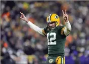  ?? PATRICK MCDERMOTT — GETTY IMAGES/TNS ?? Quarterbac­k Aaron Rodgers (12) of the Green Bay Packers and from Chico celebrates after a touchdown during the third quarter against the Minnesota Vikings at Lambeau Field on Jan. 2, 2022, in Green Bay, Wis.