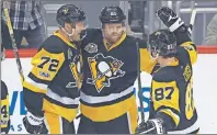  ?? AP PHOTO ?? Pittsburgh Penguins’ Phil Kessel (81) celebrates his goal with Patric Hornqvist (72) and Sidney Crosby (87) during the first period in Game 5 of an NHL first-round hockey playoff series against the Columbus Blue Jackets in Pittsburgh, Thursday.