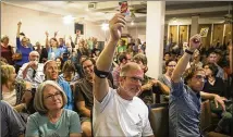  ?? NICK WAGNER / AMERICAN-STATESMAN ?? Bouldin Creek residents vote Tuesday night to oppose a permit applicatio­n by the Warren Wildlife Gallery. The gallery is trying to secure a permit that would allow the public more access to the taxidermy collection.