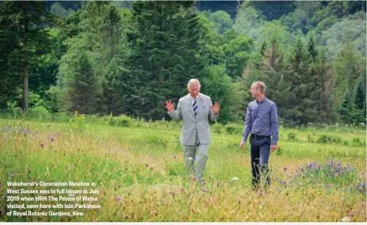  ??  ?? Wakehurst’s Coronation Meadow in West Sussex was in full bloom in July 2019 when HRH The Prince of Wales visited, seen here with Iain Parkinson of Royal Botanic Gardens, Kew
