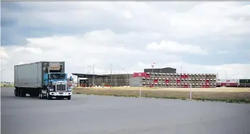  ?? TROY FLEECE ?? A semi tractor-trailer unit leaves the Canadian Pacific Intermodal Facility at the Global Transporta­tion Hub just west of Regina on Wednesday. The province is trying to divest its interest in the GTH.