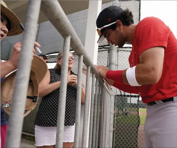  ?? STEVE HELBER — THE ASSOCIATED PRESS ?? Top Boston Red Sox prospect Marcelo Mayer signs autographs during spring training at Jet Blue Park on March 16, 2022 in Fort Myers, Fla.