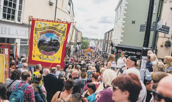  ?? ?? Banners march over Elvet Bridge at the 2019 Durham Miners’ Gala.