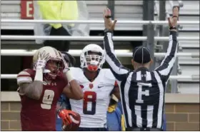  ?? MARY SCHWALM — ASSOCIATED PRESS ?? Boston College defensive back John Johnson, left, reacts as the referee signals a touchdown on a catch by Syracuse wide receiver Steve Ishmael during the second half of Saturday’s game in Boston.