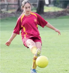  ??  ?? Drouin’s Sylvia Cooper boots the ball into attack during the under 15 girl’s match; Photograph­s: Michael Robinson.