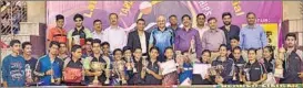  ??  ?? Winners pose with their trophies at the end of the State Table Tennis Championsh­ip in Noida on Sunday.