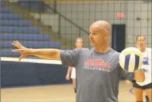  ?? The Sentinel-Record/Richard Rasmussen ?? REBEL TRAINING: Ole Miss head volleyball coach Steven McRoberts runs a volleyball camp at Lakeside Athletic Complex Thursday. McRoberts worked with 20 Ram volleyball players at the camp, using different techniques to help improve their skills.