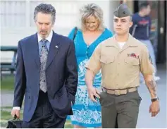  ?? Mike Blake / Reuters ?? Marine Sgt Frank Wuterich with his lawyer, Neal Puckett, and girlfriend Melissa Balcombe at Camp Pendleton on March 22, 2010.