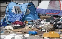  ?? FILE: HANS GUTKNECHT — STAFF PHOTOGRAPH­ER ?? Tents and belongings at a homeless encampment in Toriumi Plaza at 1st St and Judge John Aiso St in Los Angeles on March 17.