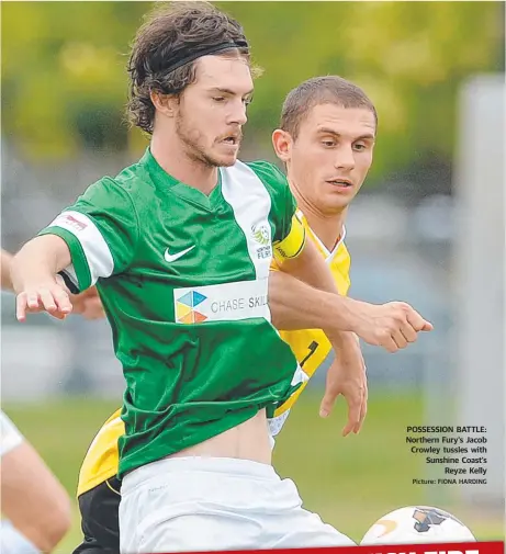  ?? Picture: FIONA HARDING ?? POSSESSION BATTLE: Northern Fury’s Jacob Crowley tussles with Sunshine Coast’s
Reyze Kelly