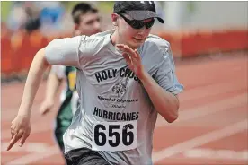  ?? CLIFFORD SKARSTEDT EXAMINER ?? Holy Cross Hurricanes’ Braden Fallis gets off to a flying start in a 400-metre race during the 2018 Special Olympics Ontario School Championsh­ips being hosted by Peterborou­gh on Wednesday at Thomas A. Stewart track.