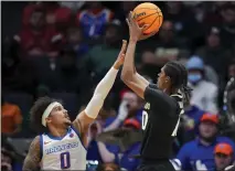  ?? ?? Colorado forward Cody Williams, right, shoots against Boise State guard Roddie Anderson III, left, during Wednesday’s game in Dayton, Ohio.