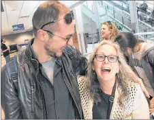  ?? FRAM DINSHAW/THE NEWS ?? Bader Albarazi and Donna Collins greet each other at Stanfield Airport on Thursday evening.