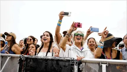  ?? PHOTOS BY MEGHAN MCCARTHY / THE PALM BEACH POST ?? Fans watch ska-punk band Sublime with Rome perform on the Ford Stage on Sunday during the final day of SunFest 2018 in West Palm Beach. Other headliners included funk-rock group DNCE, alt-rock band Cake and rapper Pitbull.