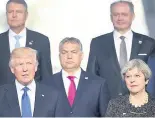  ??  ?? OUT IN FRONT Trump at Nato photoshoot