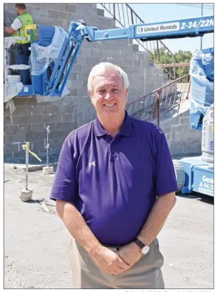  ?? STACI VANDAGRIFF/RIVER VALLEY & OZARK EDITION ?? Mayflower Superinten­dent John Gray stands in front of the home football bleachers that are undergoing renovation for this fall. The work is part of a $5.65 million project to upgrade athletic facilities in the school district. Voters approved extending a debt-service millage to fund the project, which includes a new field house.