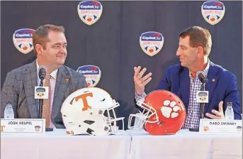  ?? Carl Juste/miami herald/tnS ?? On Dec. 7., Tennessee coach Josh Heupel, left, and Clemson coach Dabo Swinney gave statements during their press conference prior to squaring off in the Orange Bowl on Dec. 30 at Hard Rock Stadium in Miami Gardens, Florida.