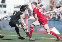  ??  ?? Canada’s Hannah Darling tries to head up field against New Zealand’s Ruby Tui during the cup final at Westhills Stadium in Langford on Sunday.