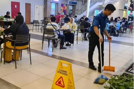  ?? The Straits Times/ann Photo ?? A young cleaning worker at a shopping mall in South Tangerang, in Indonesia's Banten province.