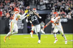  ?? Heidi Fang Las Vegas Review-journal @Heidifang ?? Raiders tight end Darren Waller reaches for a pass between Chiefs safety Juan Thornhill, left, and linebacker Nick Bolton during the fourth quarter of Kansas City’s 41-14 victory Sunday.