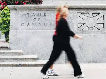  ?? CHRIS ROUSSAKIS/FILES ?? With Canada among the world’s strongest economies, markets are betting the Bank of Canada will increase the interest rate Wednesday. The bank will also unveil its inflation and growth outlook.