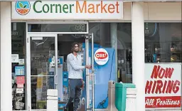  ?? TONY DEJAK/AP ?? A “Now Hiring” sign sits in a window as a man leaves a store Thursday in Lyndhurst, Ohio.