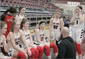  ?? Photograph by Samantha Huffman ?? Lady Blackhawk head coach Heath Neal confers with the team during the game Wednesday in Morrilton against Nashville.