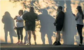  ?? Photo / NZME ?? Shoppers practise social distancing in a supermarke­t queue in Hastings.