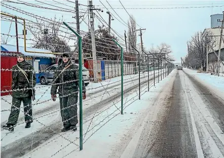  ?? AP ?? Russian guards patrol their country’s border with Ukraine.