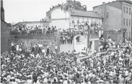  ?? BALTIMORE SUN ?? Hundreds of people show up on June 22, 1939, for the funeral of noted jazz drummer Chick Webb, who was born in Baltimore and died at age 34.