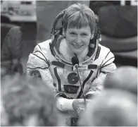  ?? Associated Press ?? ■ Astronaut Peggy Whitson, a member of the main crew of the expedition to the Internatio­nal Space Station, speaks with her relatives Nov. 17, 2016, prior the launch of Soyuz MS-3 spaceship at the Russian leased Baikonur cosmodrome, Kazakhstan.