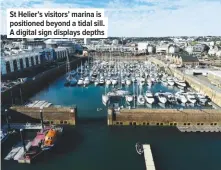  ??  ?? St Helier’s visitors’ marina is positioned beyond a tidal sill. A digital sign displays depths