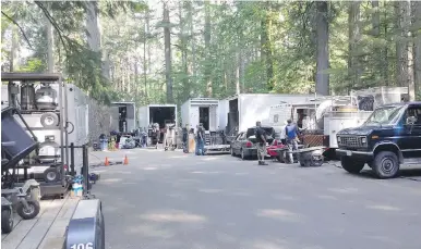  ??  ?? Crews gather in the Elk Falls area near Campbell River in 2015 during the filming of Into the Forest. The movie featured Ellen Page and Evan Rachel Wood as sisters struggling to survive in a post-apocalypti­c world.