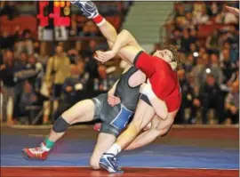  ?? PHOTO COURTESY ROD JAMES ?? Exeter’s Austin Desanto takes down an opponent during the South Central AAA Regional at Hersheypar­k Arena last season.