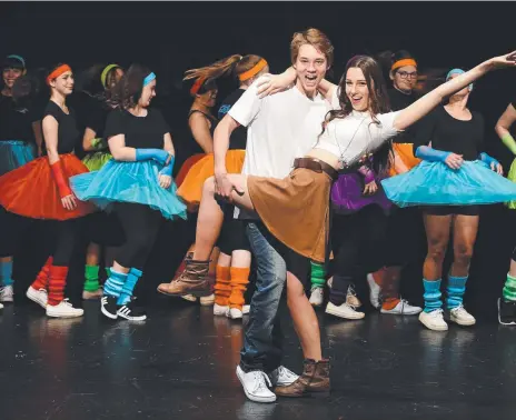  ??  ?? Levi Pulford (Ren) and Emma Carson (Ariel) lead the colourful cast in Aquinas College’s musical production Footloose. Pictures: JOHN GASS