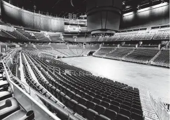  ?? Stephen M. Dowell / Orlando Sentinel ?? Stadiums across the sports world, such as the Orlando Magic’s Amway Center, sit empty because of the novel coronaviru­s outbreak.