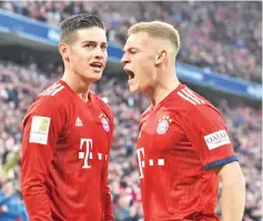  ?? - AFP photo ?? Bayern Munich’s midfielder Joshua Kimmich (R) and Bayern Munich’s Colombian James Rodriguez (L) react after their third goal during the German first division Bundesliga football match Bayern Munich vs VfL Wolfsburg on March 9, 2019 in Munich.