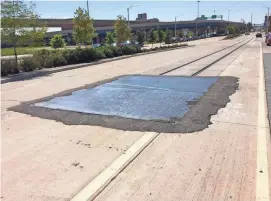  ?? TOM DAYKIN / MILWAUKEE JOURNAL SENTINEL ?? Streetcar tracks that are part of the lakefront loop end on East Clybourn Street (pictured) and East Michigan Street. The tracks are to connect through a transit concourse within the planned Couture apartment tower.