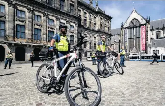  ??  ?? EXTRAORDIN­ARY investigat­ing officers (BOAS) protest on Dam Square in Amsterdam, the Netherland­s, yesterday. Due to escalating aggression, the BOAS are seeking additional equipment to better defend themselves during the Covid-19 crisis. | EPA