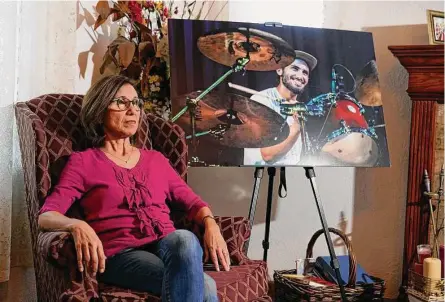  ?? Marcio Jose Sanchez / Associated Press ?? Dolores Cruz next to a photo of her son, Eric Cruz, last week in San Gabriel, Calif.
