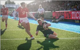  ?? ?? Coreen Grant scores Scotland’s first try against the Welsh in Cardiff