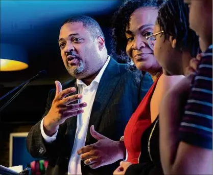  ?? Craig Ruttle / Associated Press ?? Alvin Bragg, a former top deputy to New York’s attorney general, is joined by his family as he speaks to supporters in New York on June 22. The former top deputy to New York’s attorney general was poised to become Manhattan’s first Black district attorney after his closest opponent conceded.