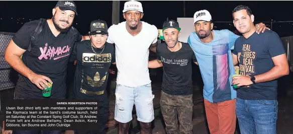  ?? DARIEN ROBERTSON PHOTOS ?? Usain Bolt (third left) with members and supporters of the Xaymaca team at the band’s costume launch, held on Saturday at the Constant Sping Golf Club, St Andrew. From left are Andrew Bellamy, Dean Ackin, Kerry Gibbons, Ian Bourne and John Outridge