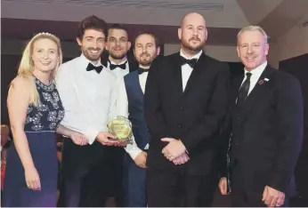  ??  ?? The team from Hyperdrive Innovation pick up the Technology of the Year Award from SAFC legend Kevin Ball.