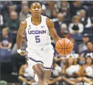  ?? Jessica Hill / Associated Press ?? Left, UConn’s Crystal Dangerfiel­d is ready for a fast-paced game against DePaul on Wednesday.