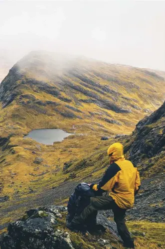  ??  ?? A hiker on Blaven, Isle of Skye; climber and author Phil Gribbon, left