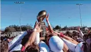  ?? Sean Patrick Bowley/Hearst Connecticu­t Media ?? Members of the Cheshire football team celebrate after defeating Southingto­n in the Apple Valley Classic to secure a Class MM playoff berth on Nov. 23, 2023.