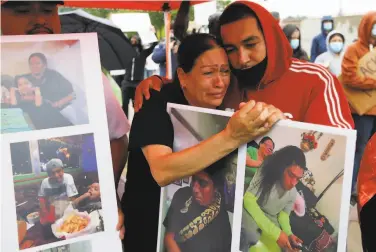  ?? Rick Bowmer / Associated Press ?? Lucy Carbajal grieves for her son, Bernardo PalaciosCa­rbajal, during a vigil in Salt Lake City. The 22yearold man was shot and killed by Salt Lake City police two weeks ago.